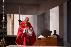 Cardinal Giovanni Battista Re blesses the coffin of Pope Francis, during his funeral Mass, in St. Peter's Square at the Vatican, April 26, 2025. REUTERS/Yara Nardi
